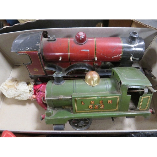 160 - A tray of toys to include two train engines, dolls etc