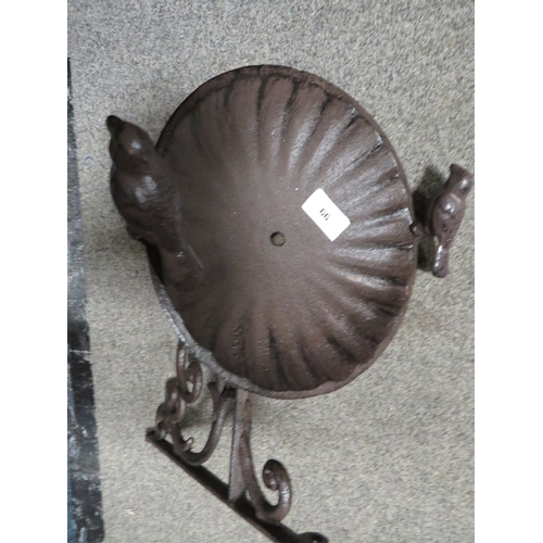 66 - **A wall mounted metal bird bath**