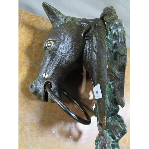 68 - **A cast metal horse head towel holder**