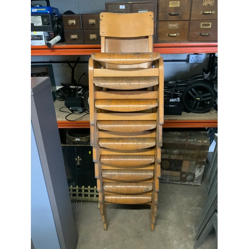 831 - A quantity of nine vintage school stackable chairs. (9)