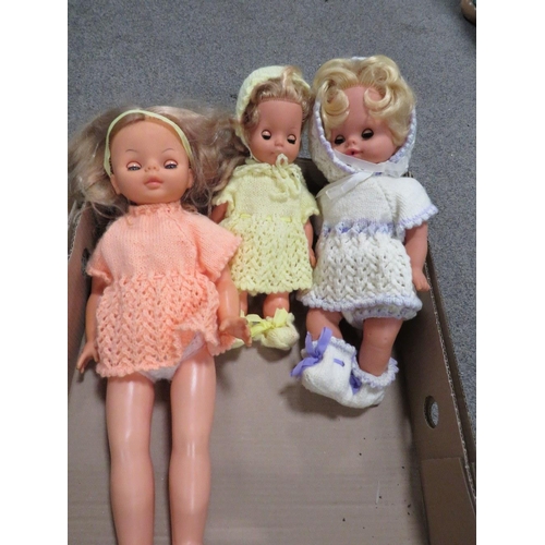 220 - A tray containing three vintage dolls together with two framed prints