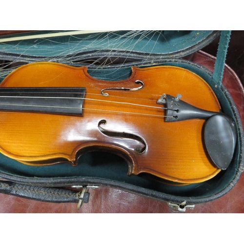 243 - A cased Chinese violin and bow