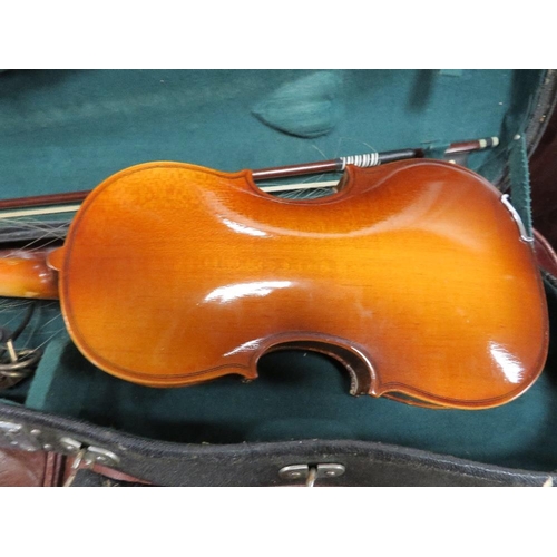 243 - A cased Chinese violin and bow