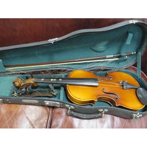 243 - A cased Chinese violin and bow