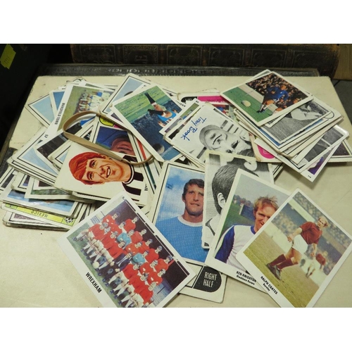 245 - A tray of phone cards, cigarette cards, Stanley Gibbons stamp album, football cards etc