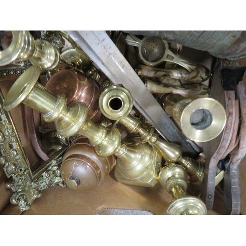 253 - A tray of brassware to include pairs of candlesticks and ornamental swords