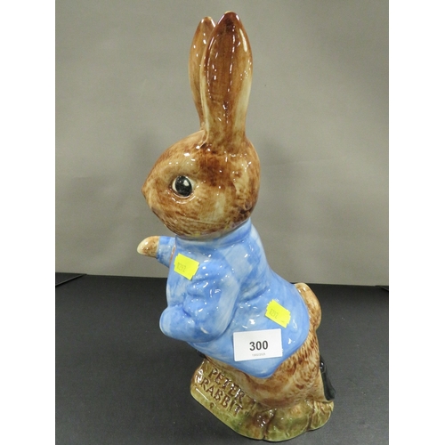 300 - A large pottery figure of Peter Rabbit with replica stamp to base