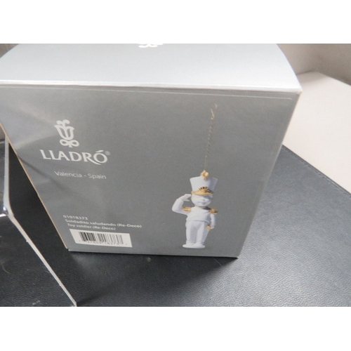 305 - A boxed Lladro figure of a clown together with a boxed Lladro toy soldier figure