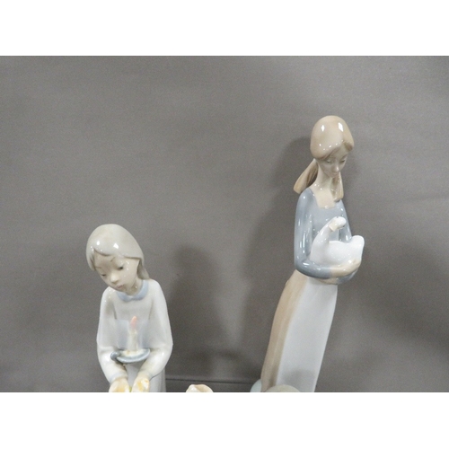 308 - Three Lladro figurines together with a Nao figurine (4)