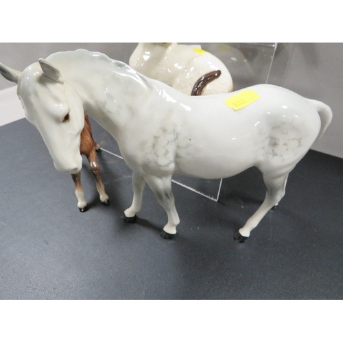 313 - A collection of five Beswick animal figures including a grey mare facing left