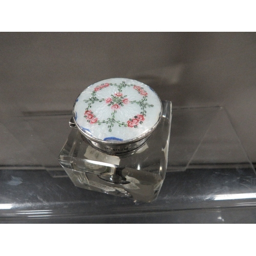 344 - A hallmarked silver and enamel mounted glass desk inkwell, the lid decorated with roses and foliage ... 