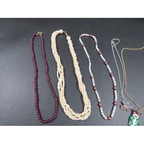 358 - A selection of six necklaces to include beads, chain with owl pendant etc