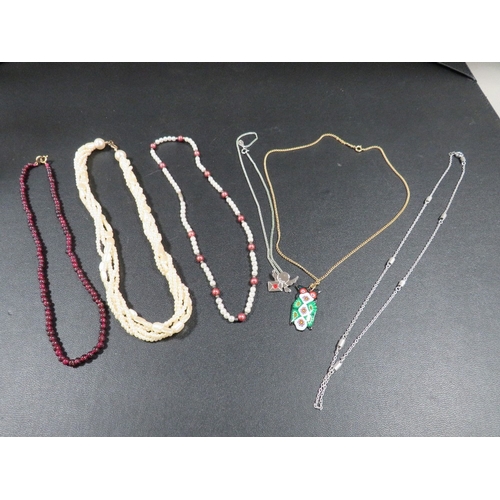 358 - A selection of six necklaces to include beads, chain with owl pendant etc