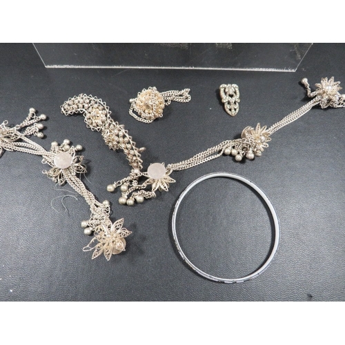 363 - A quantity of silver and white metal jewellery to include enamel bangles