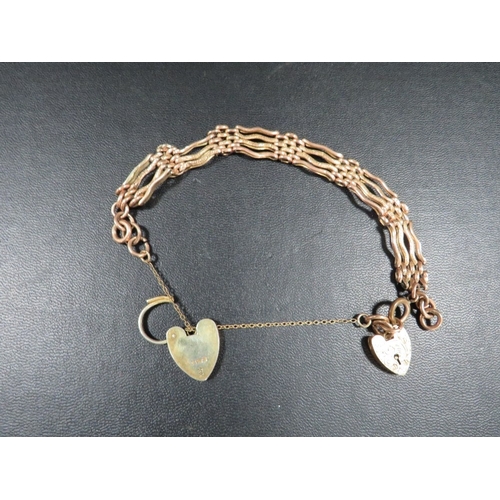 385 - A hallmarked 9 carat gold gate bracelet with additional silver padlock approx weight of chain 17g