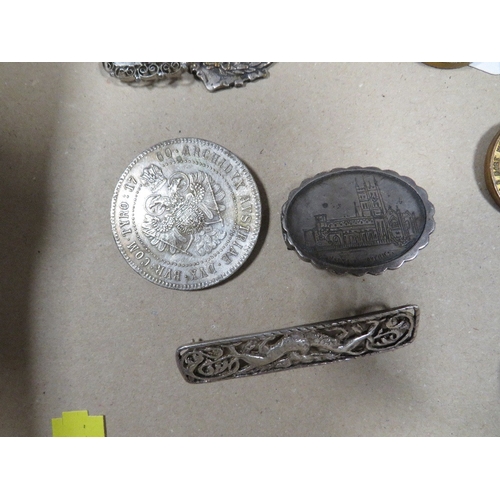 392 - A small collection of coins, brooches, fobs etc