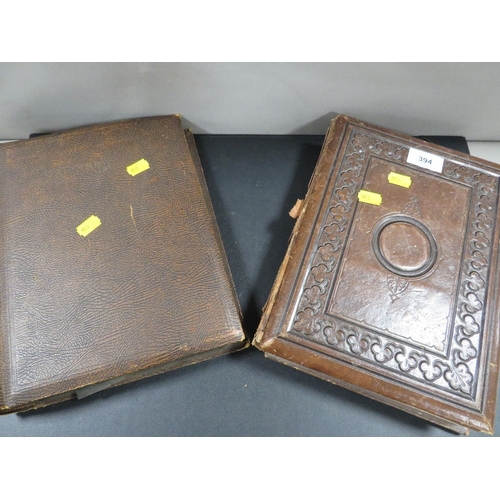 394 - An antique album  and contents together with a postcard album and contents