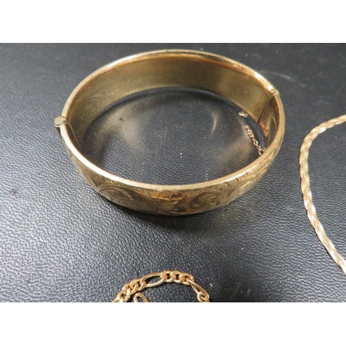 396 - Three hallmarked 9 carat gold chains approx combined weight 7.9g together with a gold plated bangle