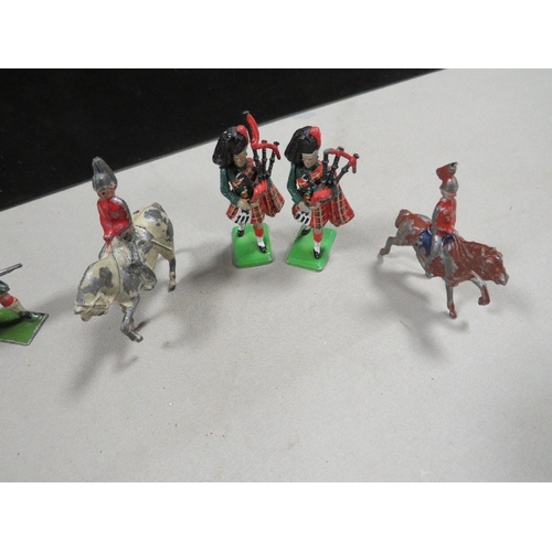 409 - A small selection of Britain's and other toy soldier figures