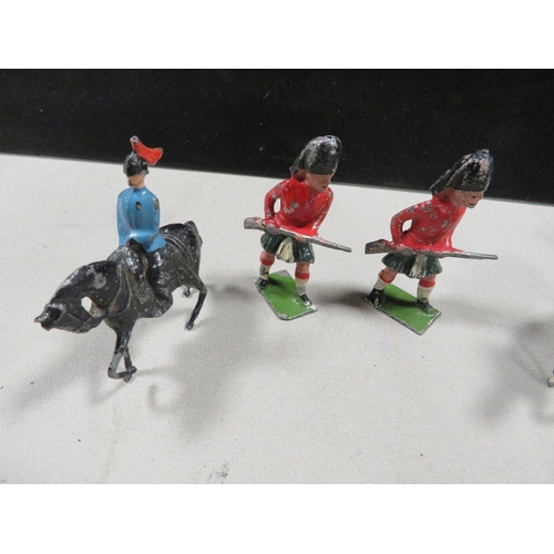 409 - A small selection of Britain's and other toy soldier figures