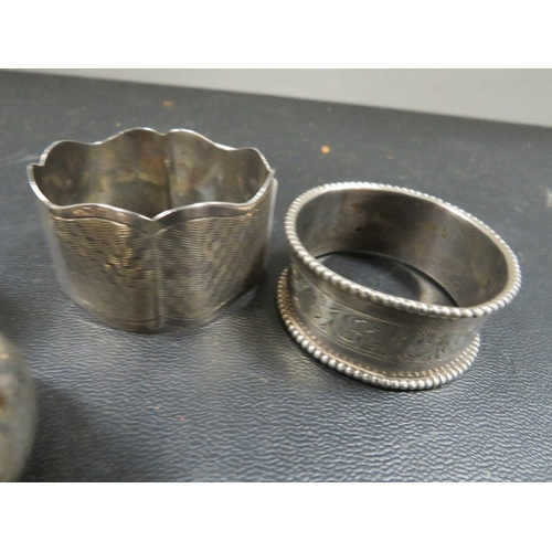 436 - A hallmarked silver salt and pepper with two silver napkin rings approx combined weight 61g