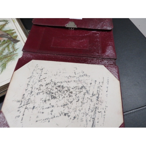 443 - A vintage photograph album and contents together with a Moroccan leather travelling writing set