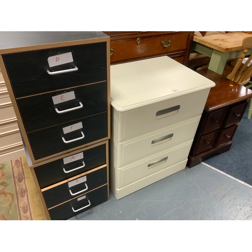 Three assorted modern cream chests together with a pair of bedside chests and a four drawer chest with a small rug
