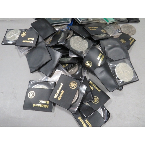 A large quantity of commemorative crown coins, including cased examples