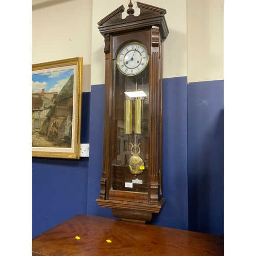 711 - A tall slender 8 day gong strike Vienna wall clock by Fenclocks of Suffolk, with Hermle movement and... 