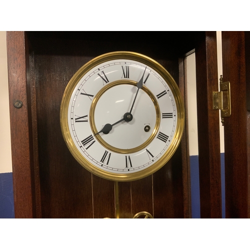 711 - A tall slender 8 day gong strike Vienna wall clock by Fenclocks of Suffolk, with Hermle movement and... 