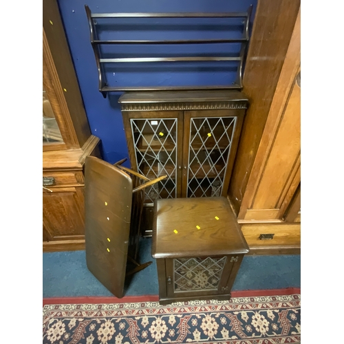 715 - A dark oak Ercol style bookcase, hi-fi cabinet, coffee table and wall shelf. (4)