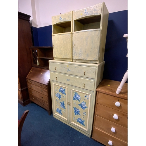 718 - A painted utility style tallboy and a pair of bedside cabinets. (3)