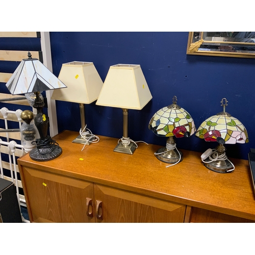 728 - A Tiffany style table lamp together with two more pairs of table lamps
