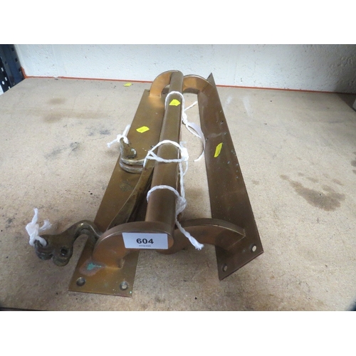 604 - A pair of vintage brass saloon style door handles