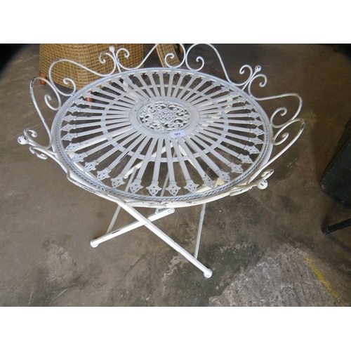643 - A wrought iron folding side table