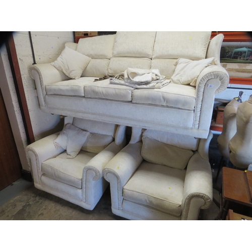 647 - A cream wing backed style 10 cushion sprung edged three piece suite with piped edges and reversible ... 