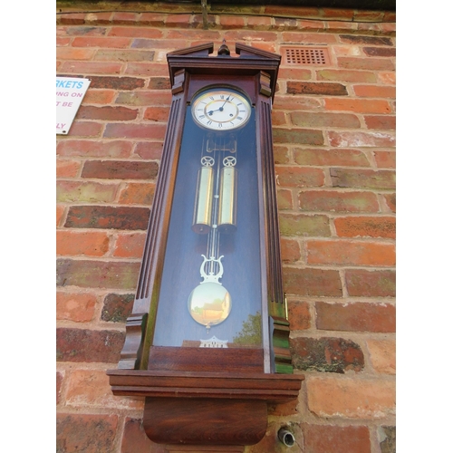 711 - A tall slender 8 day gong strike Vienna wall clock by Fenclocks of Suffolk, with Hermle movement and... 