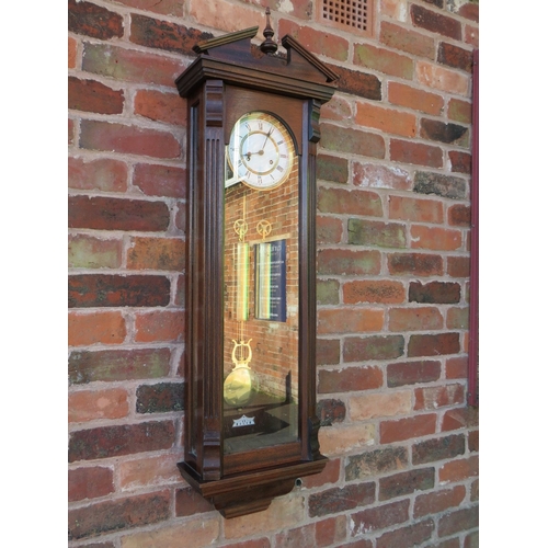 711 - A tall slender 8 day gong strike Vienna wall clock by Fenclocks of Suffolk, with Hermle movement and... 