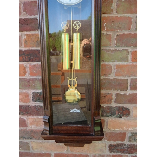 711 - A tall slender 8 day gong strike Vienna wall clock by Fenclocks of Suffolk, with Hermle movement and... 