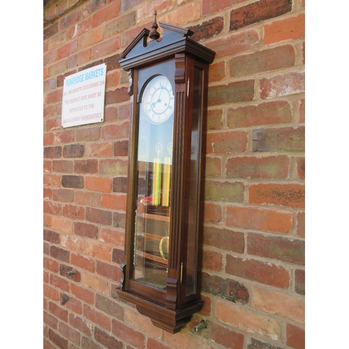 711 - A tall slender 8 day gong strike Vienna wall clock by Fenclocks of Suffolk, with Hermle movement and... 