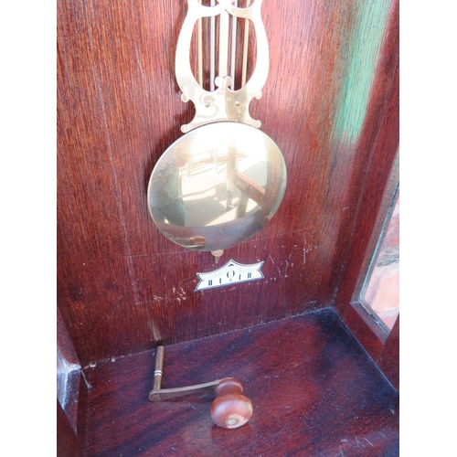 711 - A tall slender 8 day gong strike Vienna wall clock by Fenclocks of Suffolk, with Hermle movement and... 