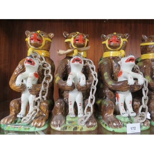 172 - Seven reproduction bear grease jugs