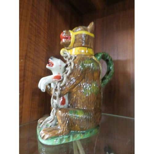 172 - Seven reproduction bear grease jugs
