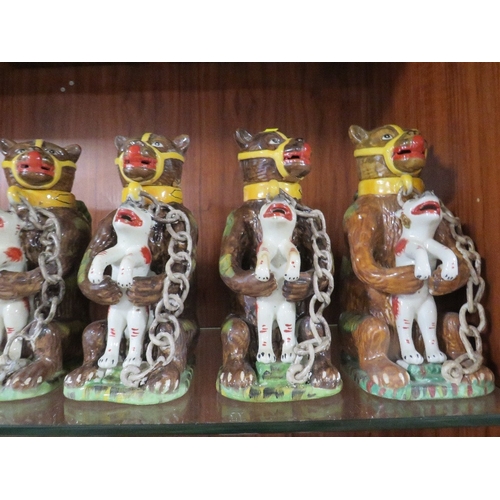 172 - Seven reproduction bear grease jugs