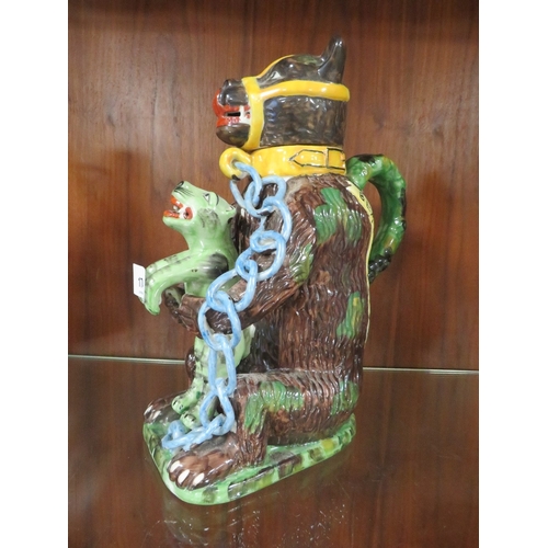 174 - A reproduction bear grease jug - the leopard coloured green with blue chains