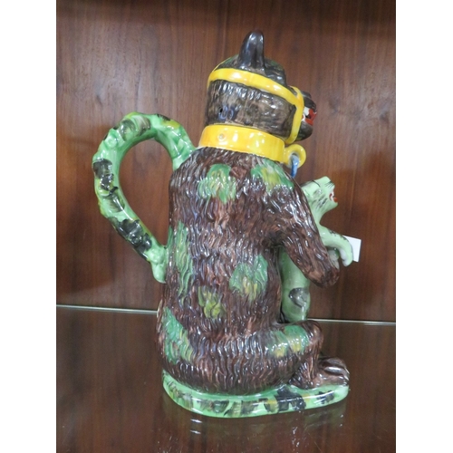 174 - A reproduction bear grease jug - the leopard coloured green with blue chains