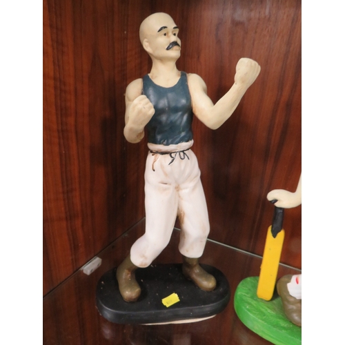 176 - Three ceramic characture figures of antique sportsman to include footballer, cricketer, and a boxer