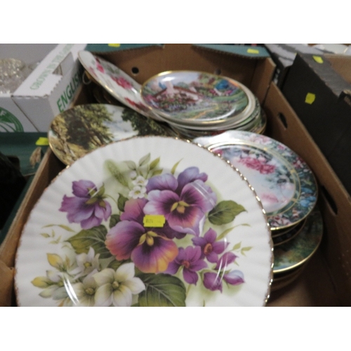 135 - A tray of assorted collectors plates