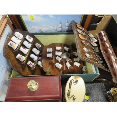 137 - A tray of collectables to include spoons, thimbles etc