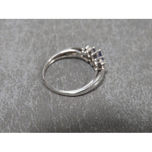 310 - A hallmarked 9 carat white gold Tanzanite and Diamond ring approx weight 2.2g ring size O½
